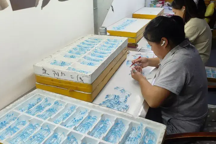 Workers inspecting eyeglasses frames Workers inspecting eyeglasses frames